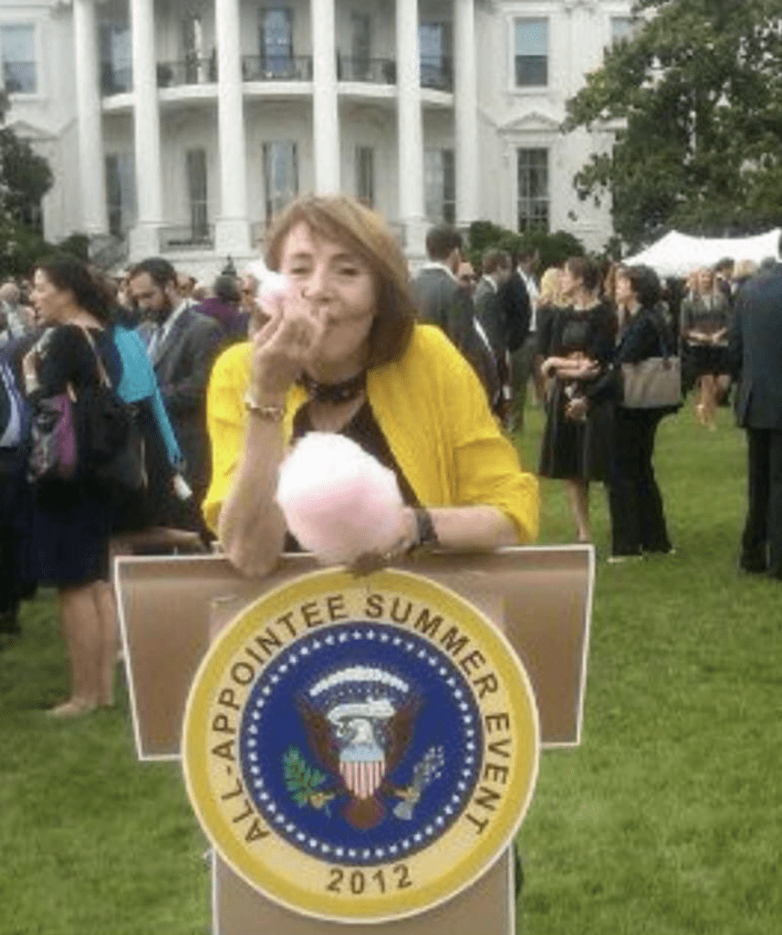 Cathy Davidson eating cotton candy on the White House Lawn at Pres and Mrs. Obama's Summer Picnic for Appointees